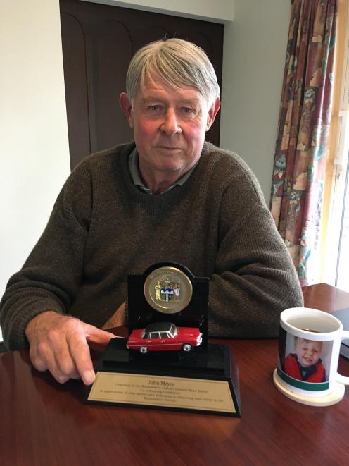John Meyer received a special trophy depicting his Rover P6B, in recognition for serving as chairman of the Waimakariri District Council's road safety committee for the last nine years. Photo: David Hill