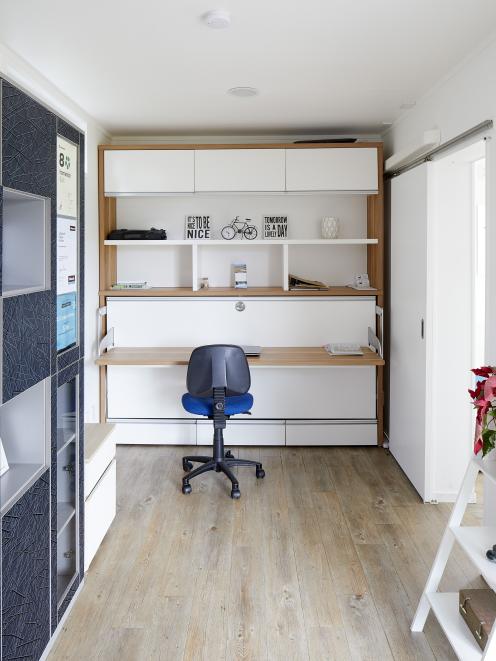 The office converts into a second bedroom (below) 