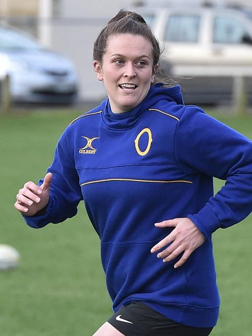 Otago lock Julia Gorinski exchanges a light moment with a team-mate during a training session at...