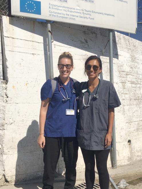 Dunedin-raised doctors Olivia Robb (left) and Natasha Keillor stand outside the Moria refugee camp. Photo: Supplied