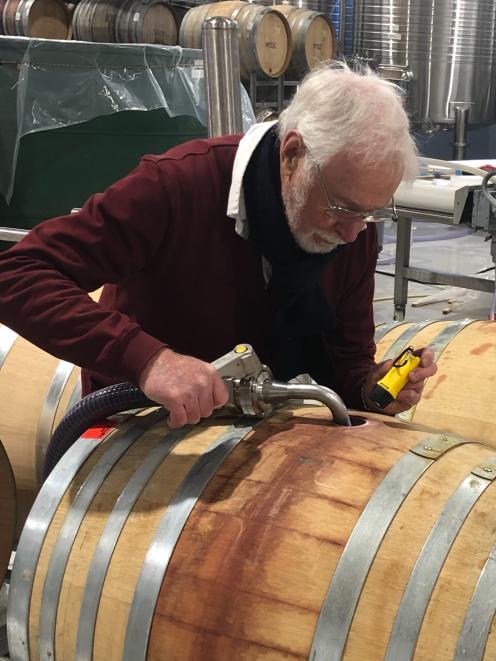 After 38 years of grape growing and winemaking in Central Otago, Alan Brady, of Clyde, fills barrels with some of his 2019 Wild Irishman Pinot Noir, in April. Photo: Alan Brady