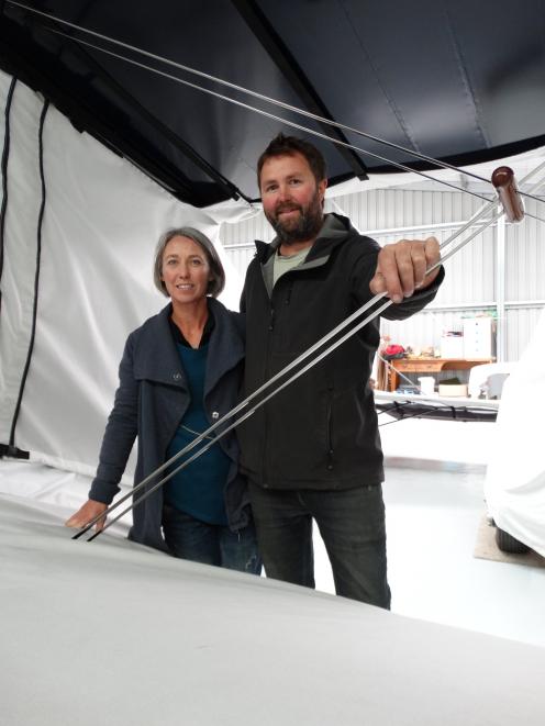 Callum Smith and wife Trish Wrigley with one of the Staggerwing aircraft they have been working...