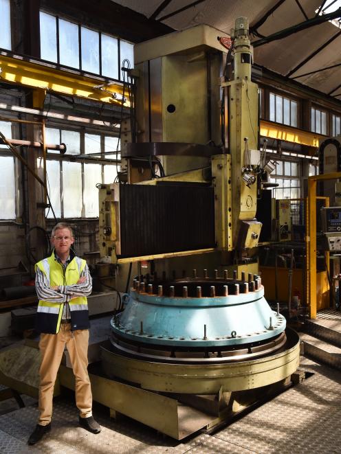 Farra Engineering chief executive Gareth Evans with a vertical lathe, working on a main input valve from Waipori Power Station. Photo: Gregor Richardson