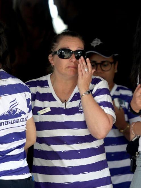 Family and friends mourn the death and serious injuries of those caught in the eruption. Photo: Getty Images