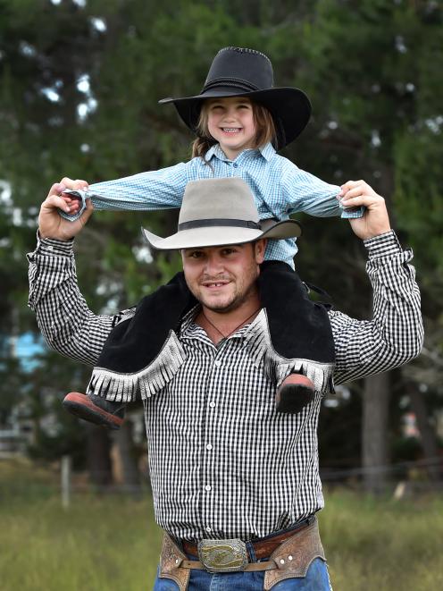 Sam Church gives Jenna Jowett a better view during the 2019 Maniototo Rodeo at the Maniototo...