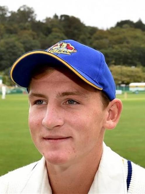 Waitaki Boys’ High School pupil Nathan Smith takes a break from the 12th-man duties during Otago...