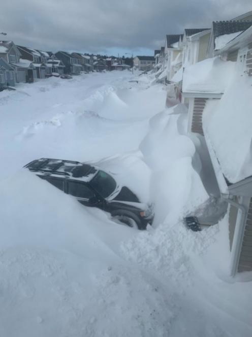 Snow piled up outside houses in St John's, Newfoundland And Labrador. Photo: J. David Mitchell...