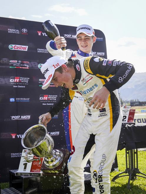 Lawson gets covered in bubbly by Franco Colapinto after winning the Toyota Racing Series opener.