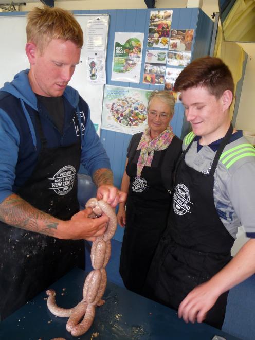 Linking the sausages is Josh Woods, watched by Pim Allen and Matt Kennedy.

