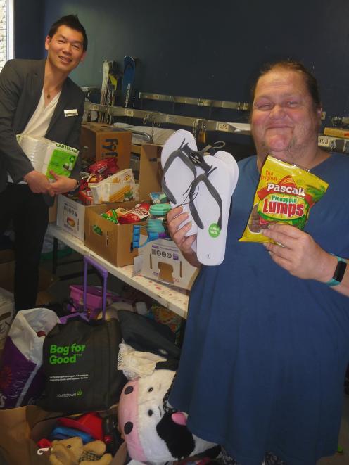 Methven Resort owner Ole Wallis (left) and Wendy White show some of the items donated by the Methven community for people affected by the bushfires in Australia. Photo: Mick Jensen