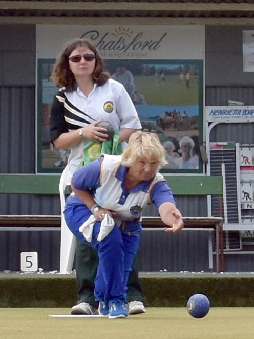 Beth Brown (Taieri) delivers a bowl while opponent Lee Grigg (Green Island) looks on. Brown...