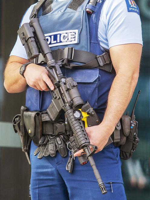 Armed police outside the Justice and Emergency Services Precinct. Photo: Geoff Sloan