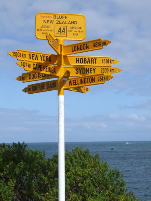 Bluff's iconic Stirling Point sign showing incorrect directions and distances to cities around the world. Photo: ODT files