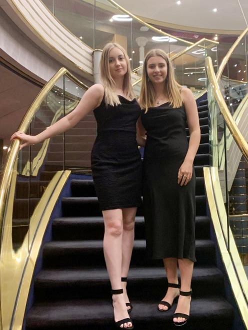 Enjoying a formal night while stranded on board a cruise ship barred from docking over...