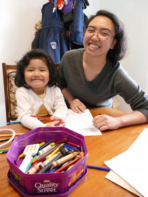 Following hopeful news on her case, deportation-threatened Maia Matubis spends time with little sister Zara at their Balclutha family home yesterday. Photo: Richard Davison