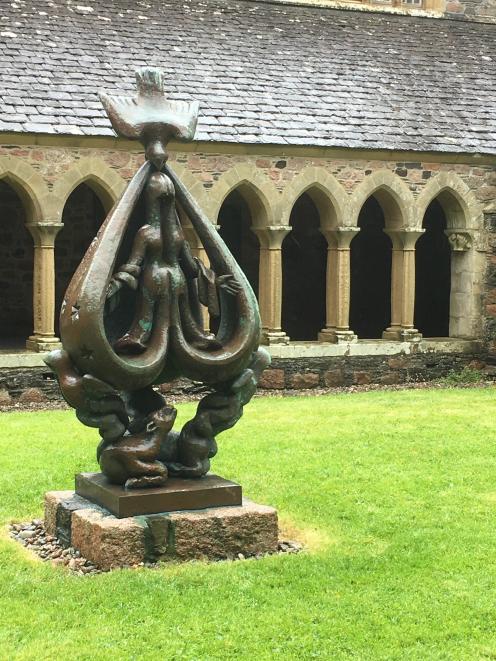 The sculpture The Descent of the Spirit in the Iona abbey cloister.