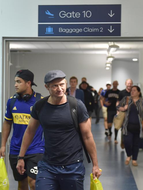Highlanders assistant coach Tony Brown and inside back Josh Ioane arrive at Dunedin Airport yesterday. Photo: Gregor Richardson