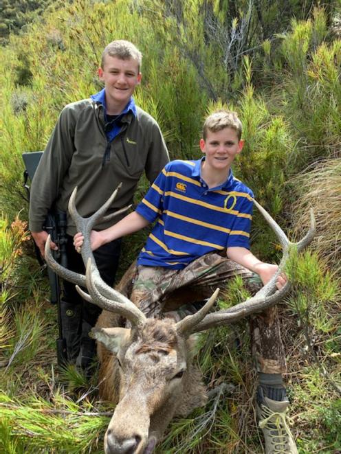 Brothers Archie (left) and Riley McRae display a trophy stag. PHOTO: SUPPLIED