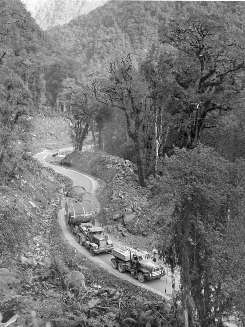 Transporting a pipe section over Wilmot Pass to West Arm. PHOTO: SUE AND ALAN MARCHANT COLLECTION...