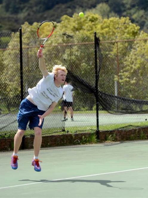 Eastern Harbour player Ryan Eggers serves in a doubles match against the Tertiary team at the...