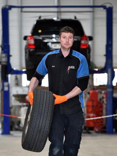 At the garage ... PD Auto mechanic Nick Johnstone, of Dunedin, gets back into business. PHOTO:...