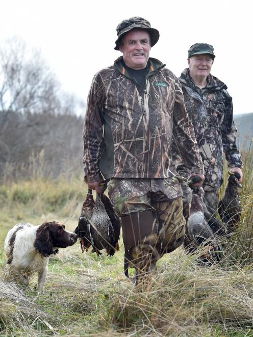  Sinclair Wetlands syndicate members Peter Lee (left) and Robert Anton, along with dog Flynn,...