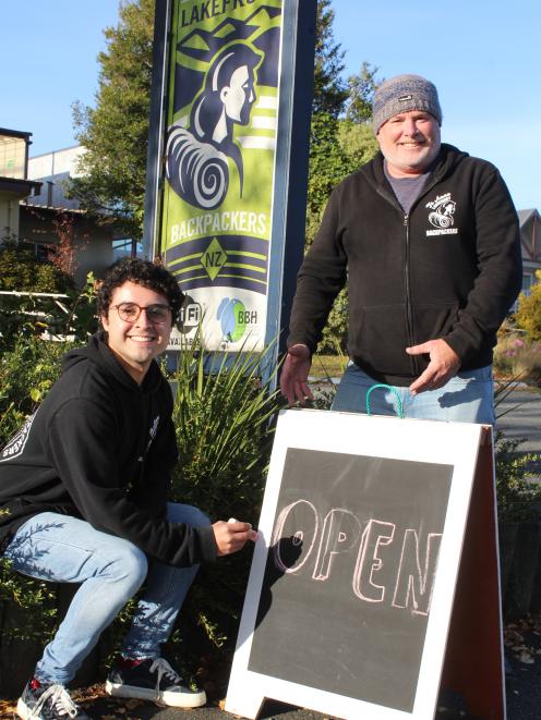 Te Anau Lakefront Backpackers receptionist Giovanni Gomez and owner Dean Costello invite guests...