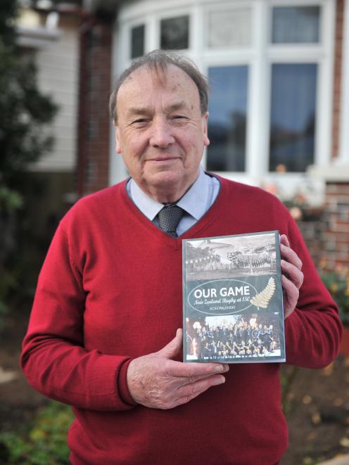 Ron Palenski with the newly published Our Game, New Zealand Rugby at 150. PHOTO: CHRISTINE O...