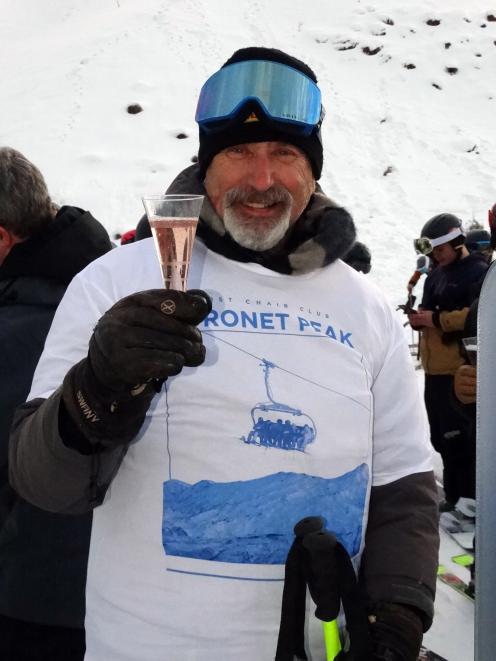 Arrowtown’s David Furniss enjoys a sparkling wine to celebrate getting on the first chair for the...