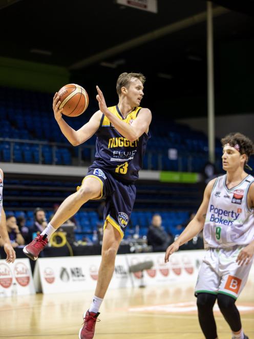 Otago Nuggets' swingman Josh Aitcheson gathers the ball against the Manawatu Jets early in the...