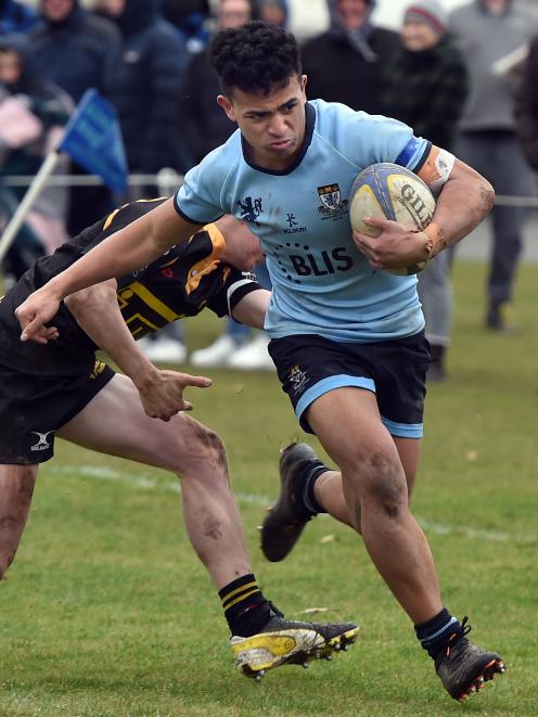 Kings High School winger Emmanual Ventura runs to score a try against Mt Aspiring during the...
