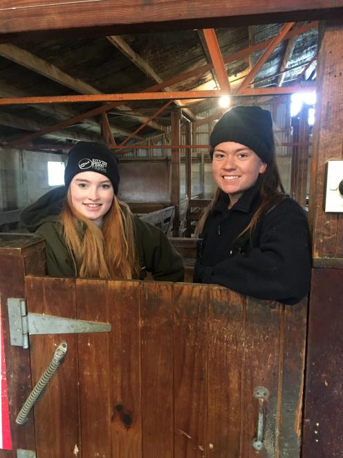 Spending time in a woolshed are Katie Gunn (17, left), of Roxburgh Area School, and Bella...