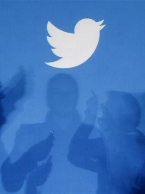 The initial public offering of Twitter closed early after investor demand. Photo by Reuters.