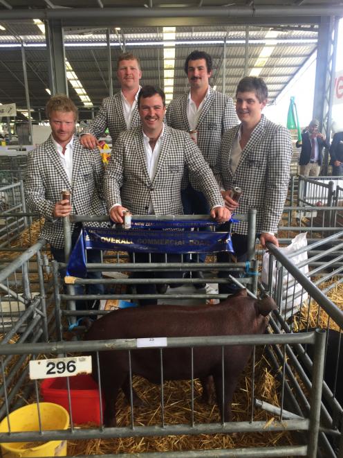 Admiring their pig at last year’s New Zealand Agricultural Show are (from left) Tom Reed, Jamie...