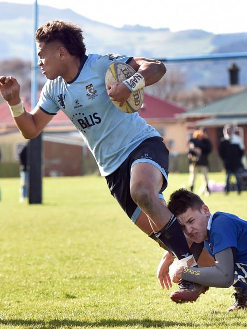 King’s High player Joji Buli is tackled by Southland Boys’ Gareth Turnock during their Otago...