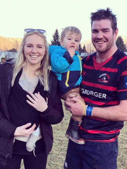 Adam and Rosie Hill with family Lockie (18 months) and new baby Goldie (four weeks) after a game...