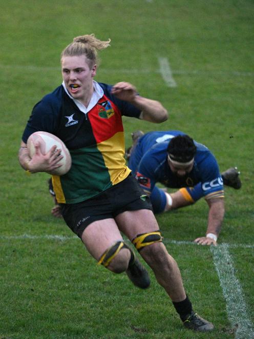 Possibles No 8 Sean Jansen goes in for a try as Probables prop Hisa Sasagi is on the ground...