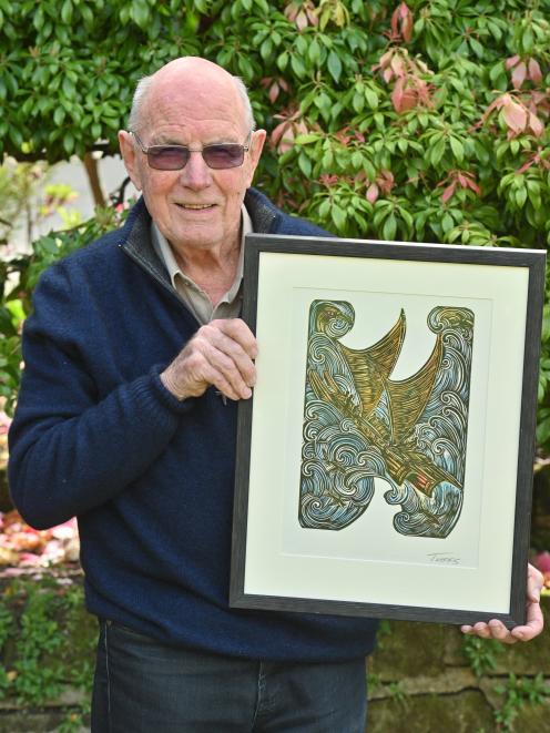 Bill Dawson, of Dunedin, holds a custom-made piece by artist Michel Tuffery that was given to him...