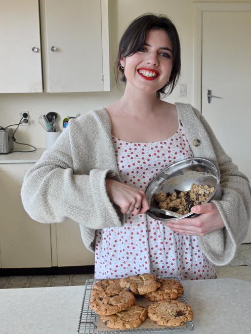 Guest chef Sophia Craig (22) bakes sesame, hemp and dark chocolate cookies in her Dunedin flat....