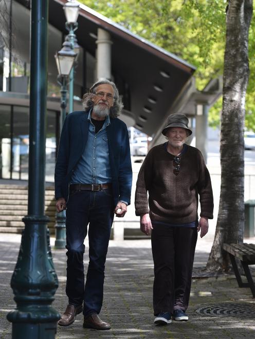 Poet, writer and publisher Roger Hickin (left) and Dunedin poet and photographer Peter Olds walk...