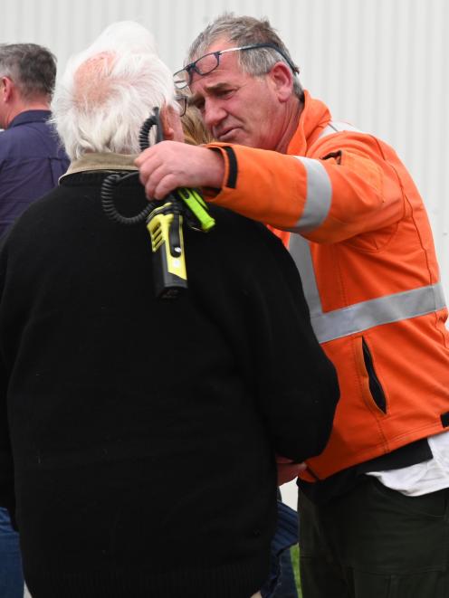 Otago Principal Rural Fire Officer Graeme Still (right) comforts Lake Ohau resident Chris Spiers.