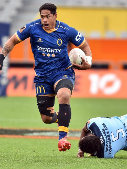 Otago No 8 Sione Misiloi gets away from Northland lock Temo Mayanavanua at Forsyth Barr Stadium...