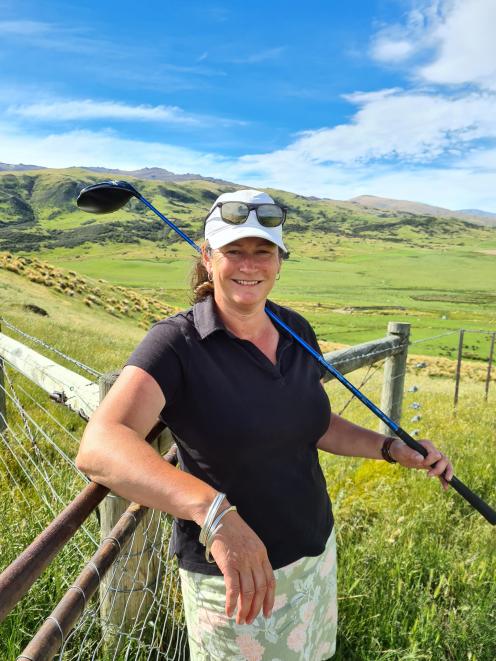 Lauder Station farmer Becs Calder at home with one of her clubs she will be using in Auckland...