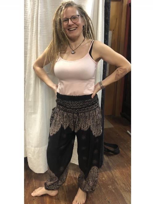 Laura is wearing harem pants — $45, and an organic cotton cami top — $45.