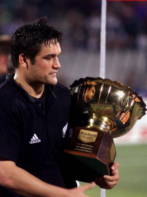 All Blacks captain Taine Randel walks away with a trophy after his team beat South African Springboks during the Tri-Nations Series in 1999. Photo: Reuters All Blacks captain Taine Randel walks away with a trophy after his team beat South African Springboks during the Tri-Nations Series in 1999. Photo: Reuters