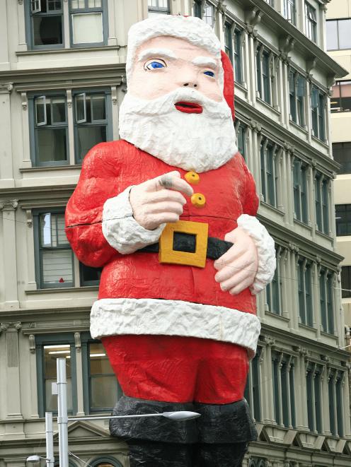 The giant Santa seen on the Whitcoulls building, in central Auckland.
...