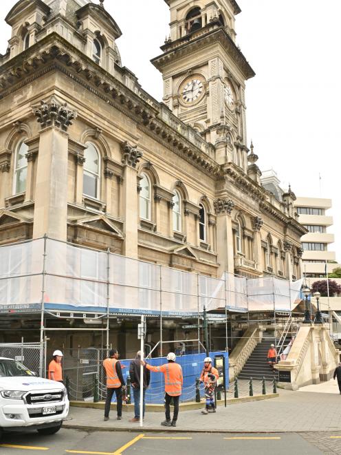 Staff from Brazier Scaffolding work outside the Municipal Chambers in the Octagon, Dunedin, to...