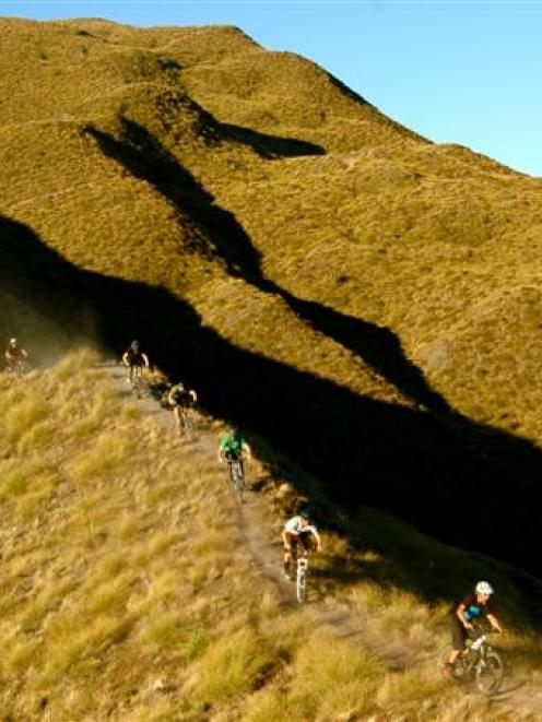 Members of the Queenstown Mountain Biking Club on the Rude Rock trail, which they completed in...