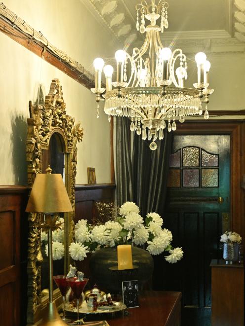 A chandelier casts a warm glow in the hallway. Photos: Linda Robertson 