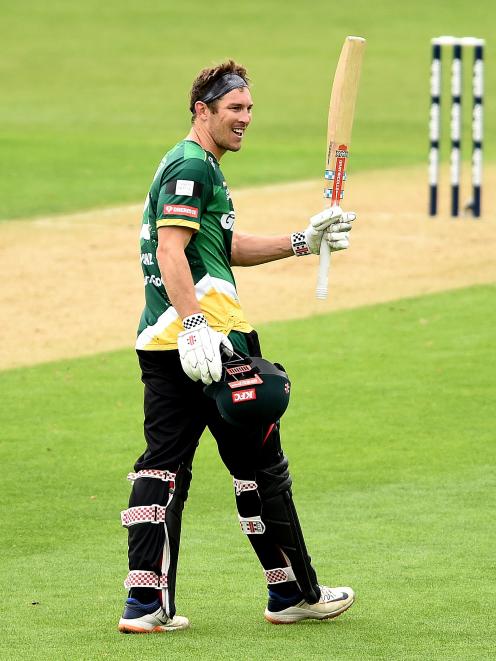 Stag batsman George Worker celebrates brining up his century.